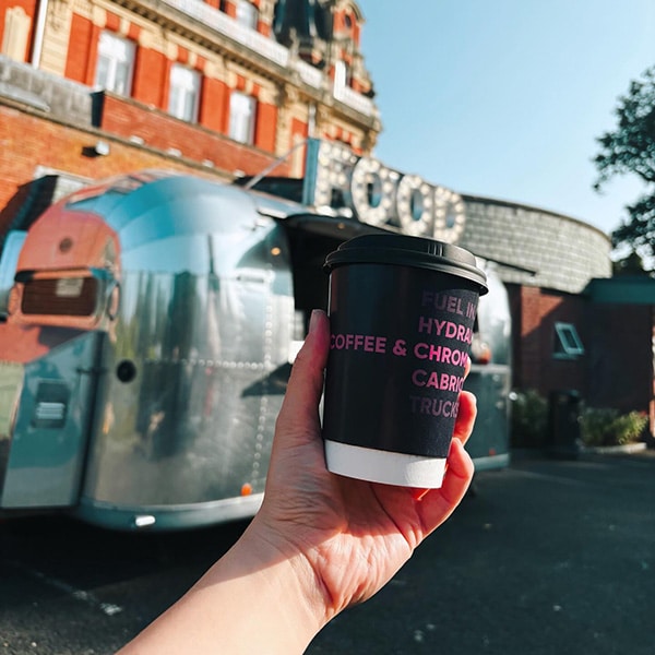 An image of a wholesale barista training a new coffee employee.